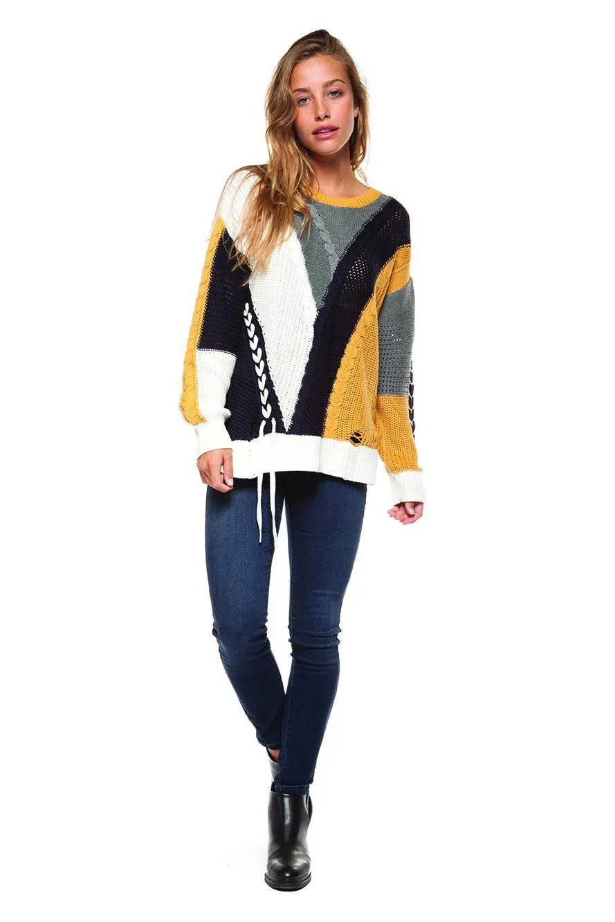 Long sleeve color block cable knit sweater with lace-up trim